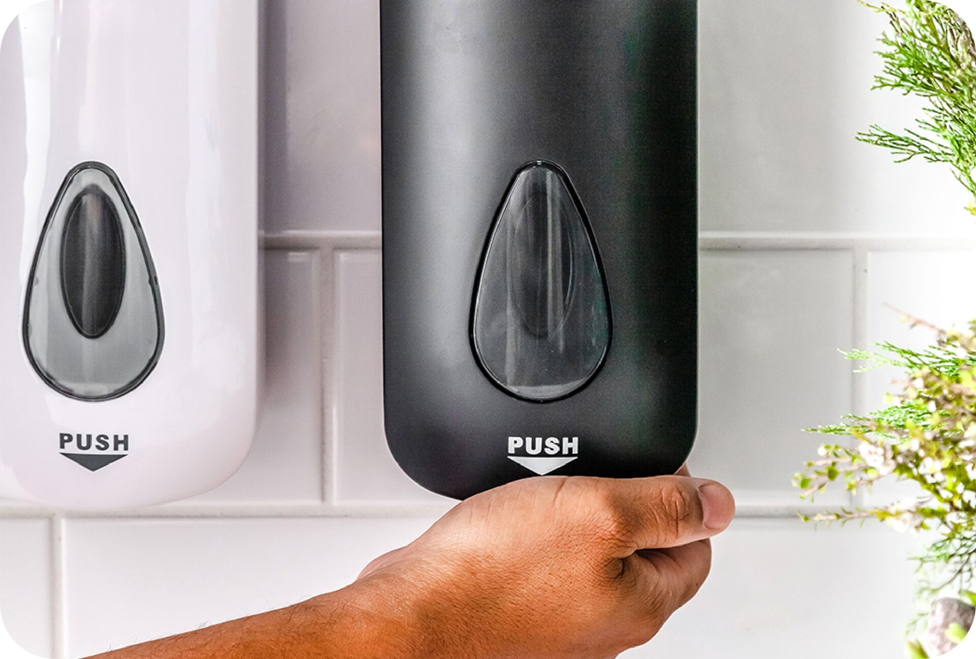 Commercial washroom soap dispensers maintained as part of professional cleaning service.