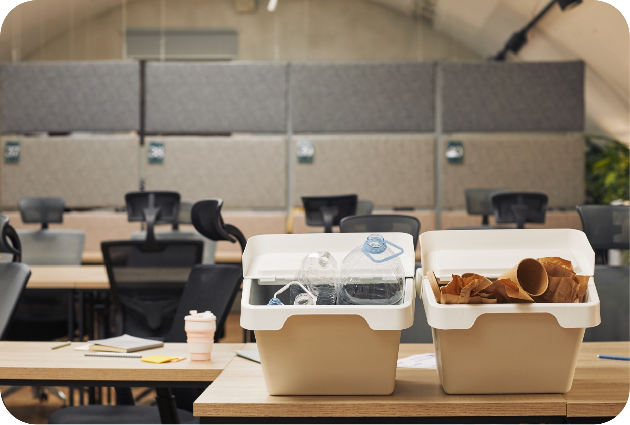 Office waste separation setup managed by Pharo Cleaning, showing recycling and general waste bins in a shared workspace environment.