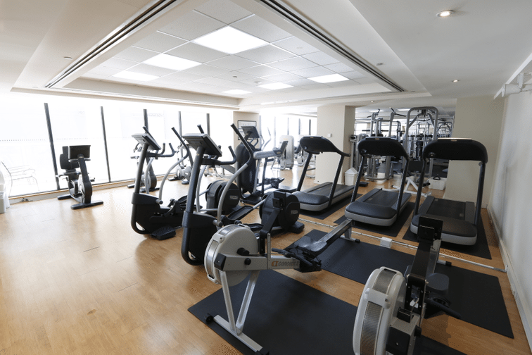 Well-maintained strata gym featuring shared fitness equipment for apartment residents.