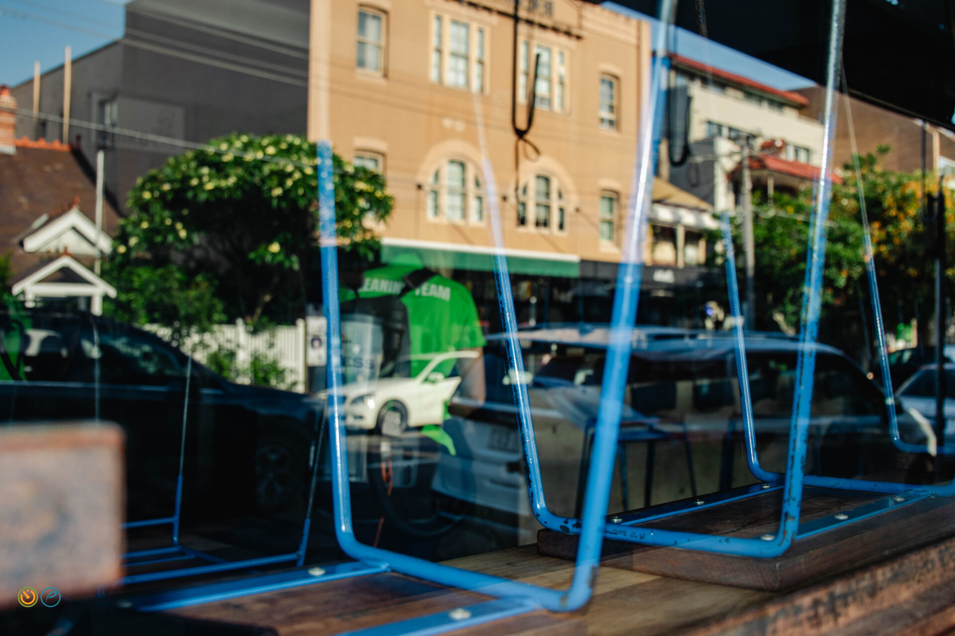 Cafe seating and front windows prepared for opening as part of hospitality commercial cleaning.